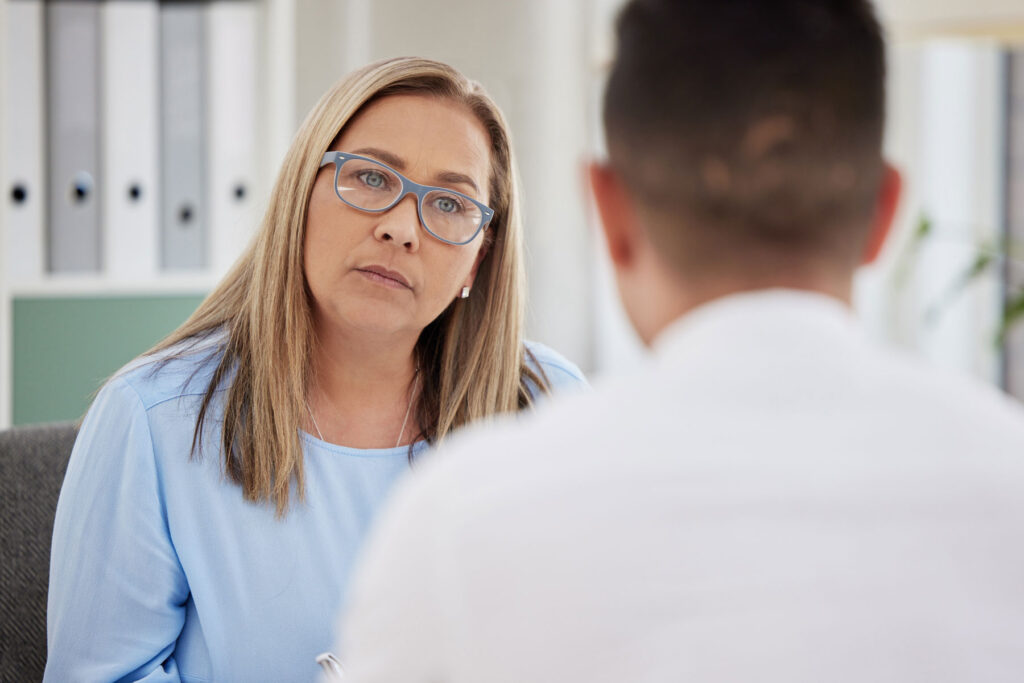 A woman learning about group therapy vs. individual therapy