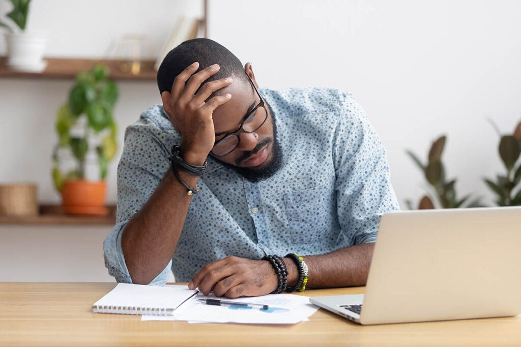 A man thinking about his stress and anger