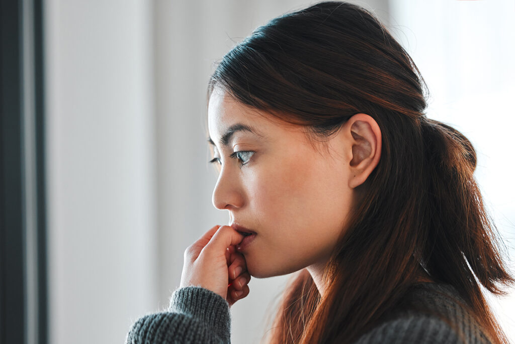 A woman wondering how to deal with anxiety